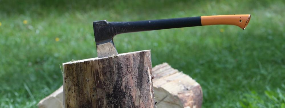  Chopping wood - ax in a log outdoors .jpg